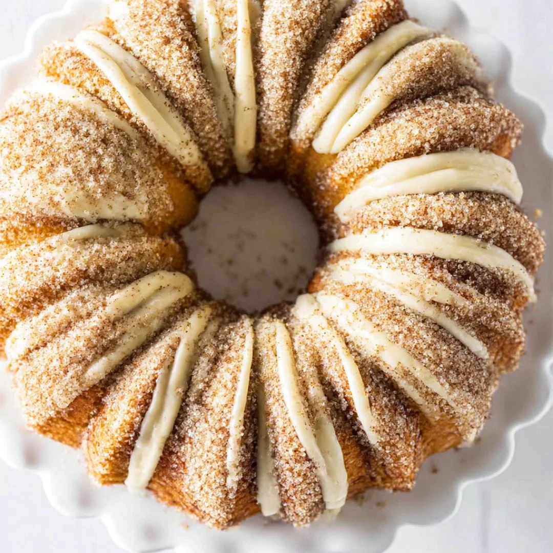 Delicious Snickerdoodle Bundt Cake topped with cinnamon sugar glaze