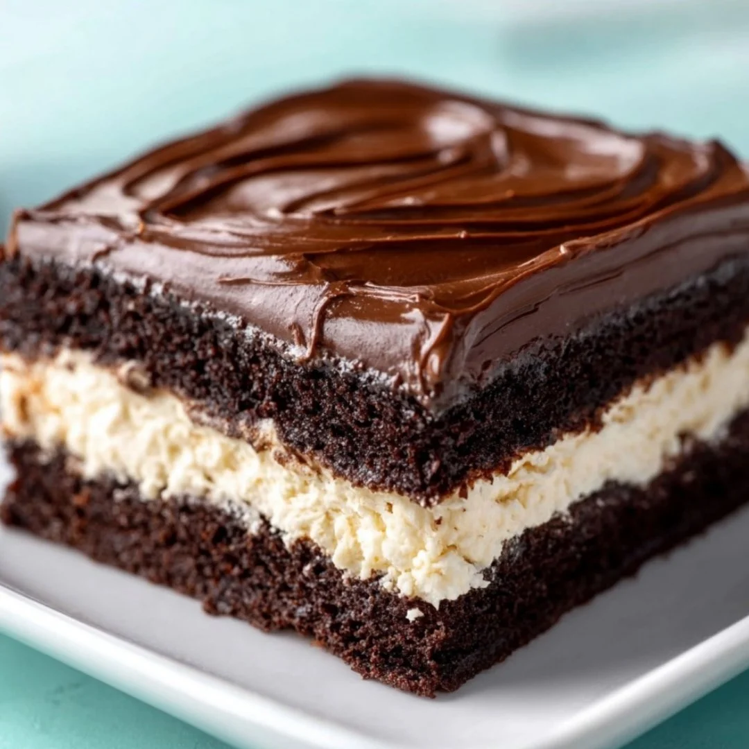 Deliciously decadent Ding Dong Cake with chocolate layers and creamy filling