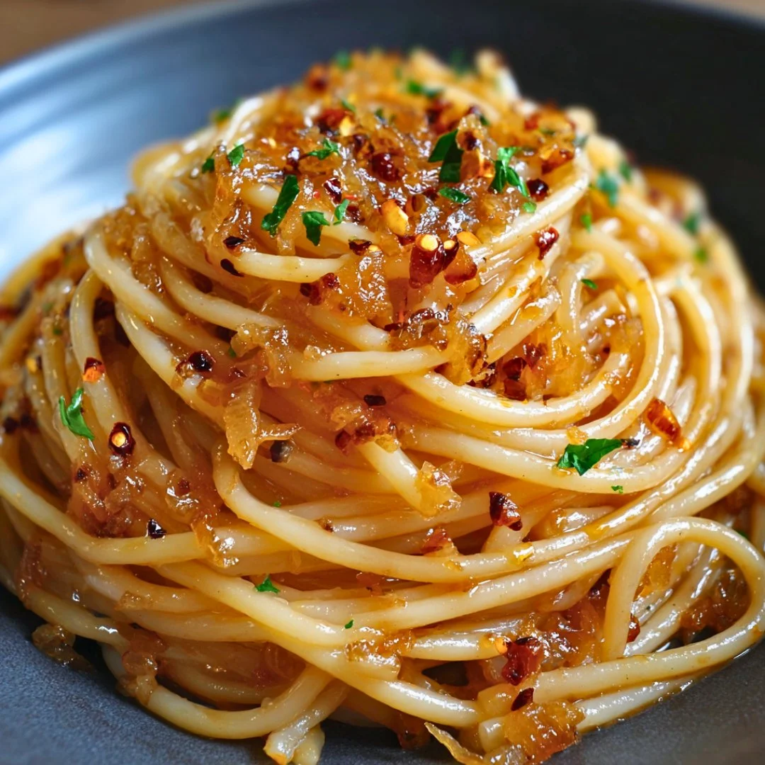 A bright, fizzy blue beverage with granulated salt crystals and a clear jar on a granite surface.