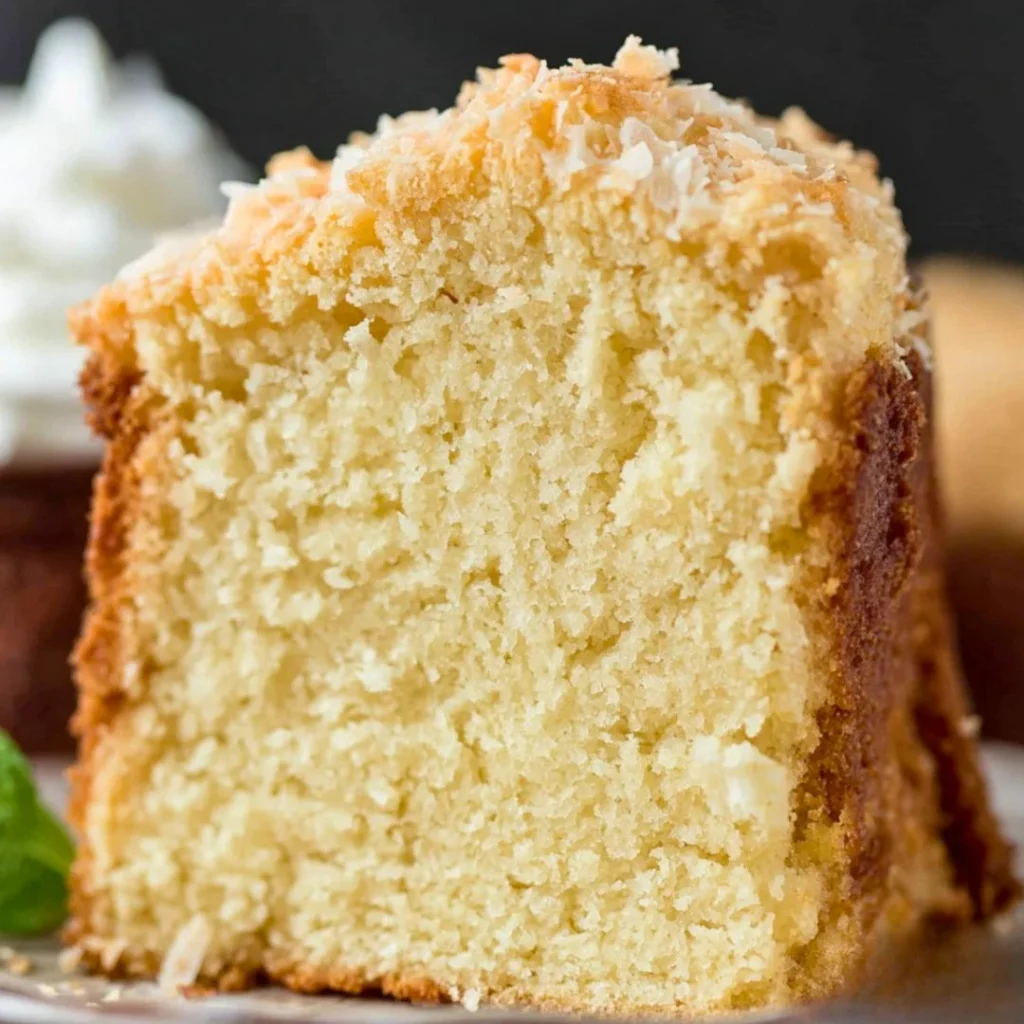 A bright, fizzy blue beverage with granulated salt crystals and a clear jar on a granite surface.