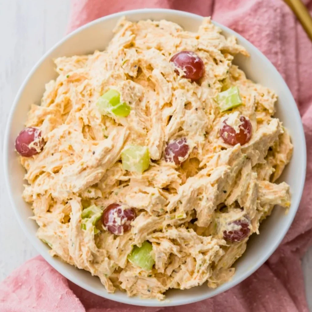 Blue_Salt_Trick_for_Men_Recipe_05 A bright, fizzy blue beverage with granulated salt crystals and a clear jar on a granite surface.