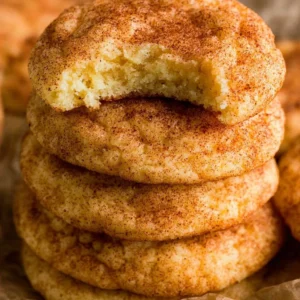 Plate of soft and chewy snickerdoodle cookies with cinnamon sugar coating