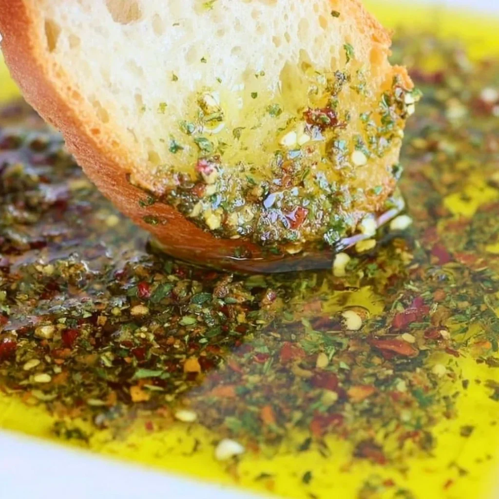 Blue_Salt_Trick_for_Men_Recipe_05 A bright, fizzy blue beverage with granulated salt crystals and a clear jar on a granite surface.