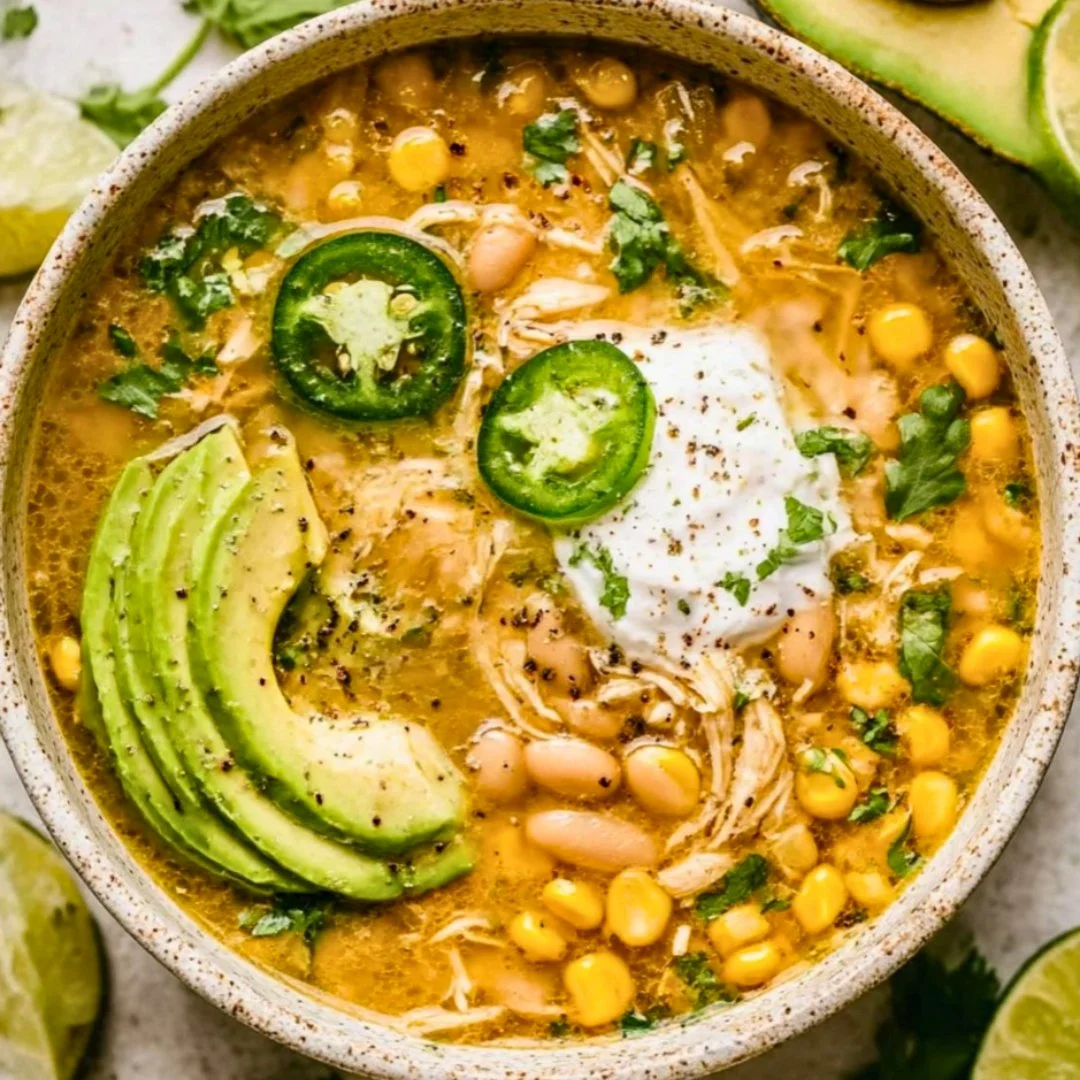 Delicious bowl of Crock Pot white chicken chili topped with cilantro and served hot