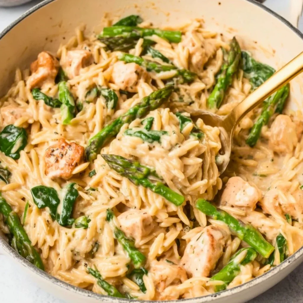 A bright, fizzy blue beverage with granulated salt crystals and a clear jar on a granite surface.