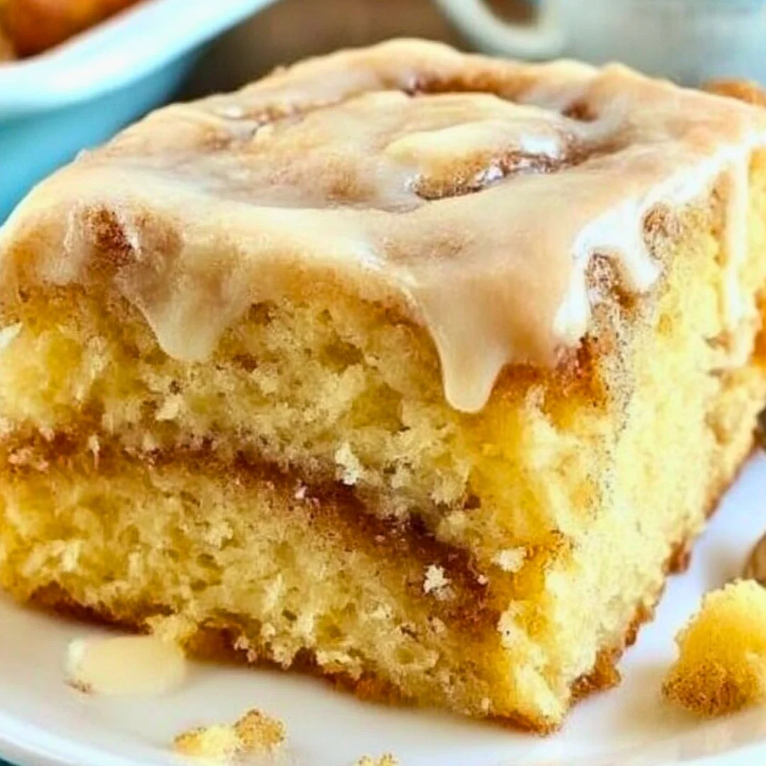 A bright, fizzy blue beverage with granulated salt crystals and a clear jar on a granite surface.