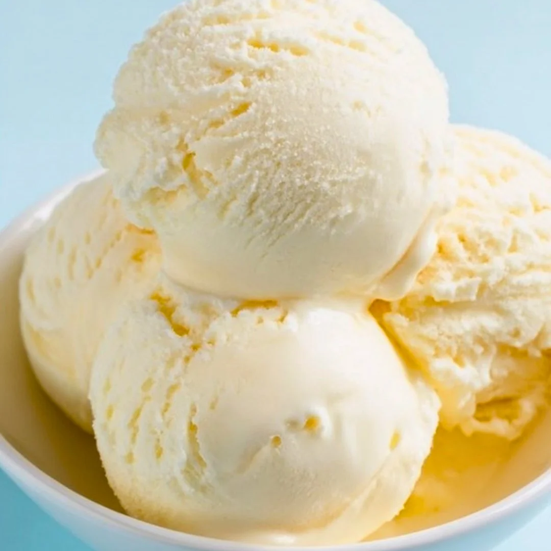 Homemade ice cream in a bowl with fresh toppings