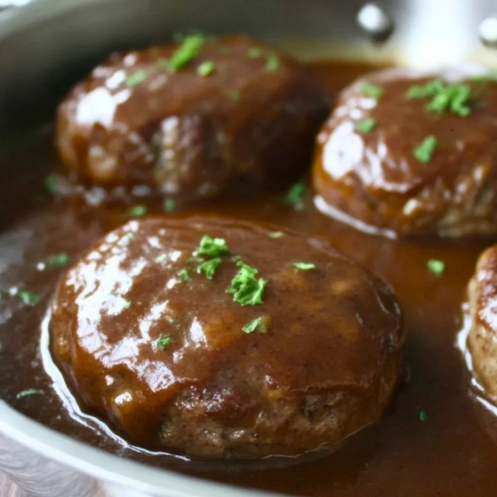 A bright, fizzy blue beverage with granulated salt crystals and a clear jar on a granite surface.