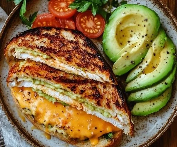 A bright, fizzy blue beverage with granulated salt crystals and a clear jar on a granite surface.