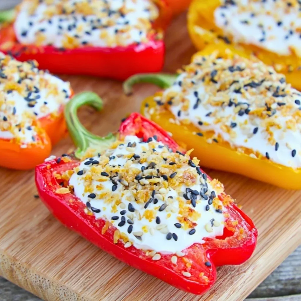 A bright, fizzy blue beverage with granulated salt crystals and a clear jar on a granite surface.