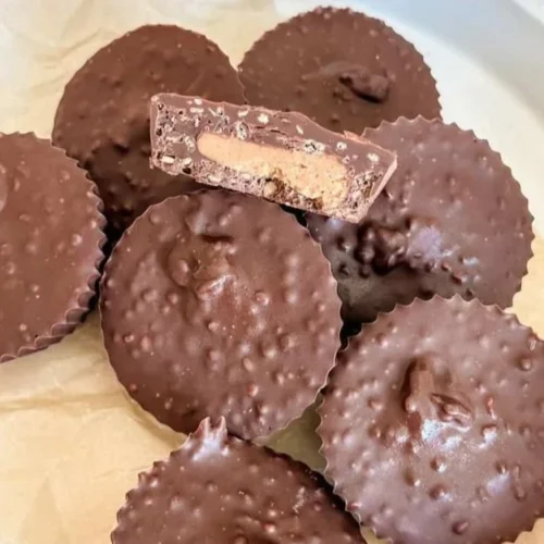 Vegan Quinoa Crunch Peanut Butter Cups with peanut butter filling and crunchy texture.