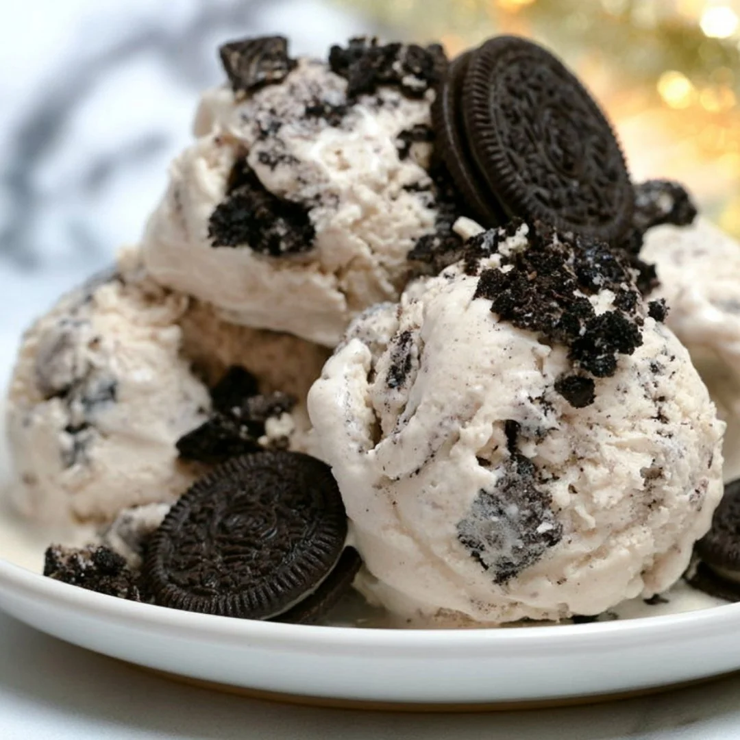 Delicious cookies and cream ice cream served in a bowl with cookie crumbles on top.
